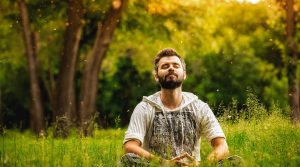 Man meditating outside