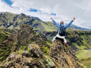 woman on top of mountain