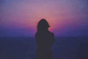 woman watching sunset