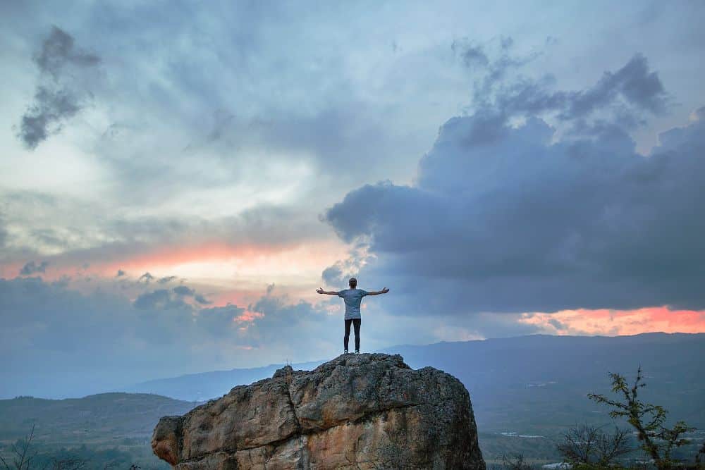 man standing on mountain