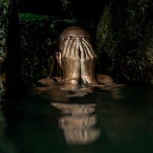 woman hiding face