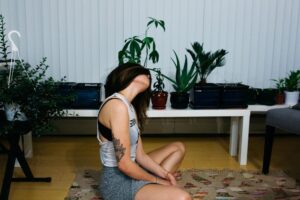 woman doing yoga at home